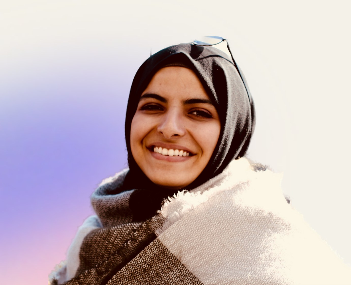 Shahed, smiling, wrapped in a scarf
