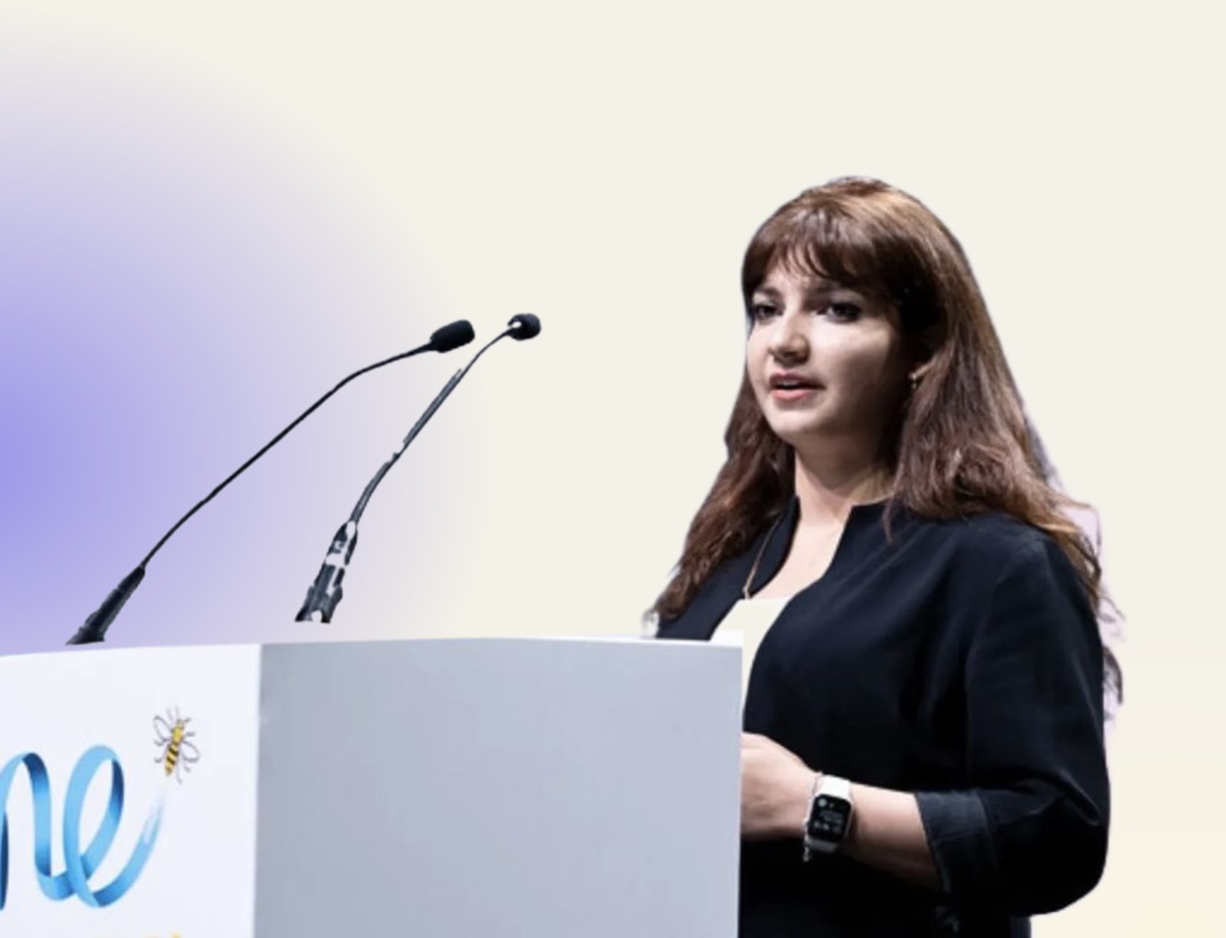Jin speaking at a podium